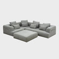 Rehomed Sabine modular grey poly-blend couch with deep seating and curved top-stitching. Includes 5 pieces and ottoman.