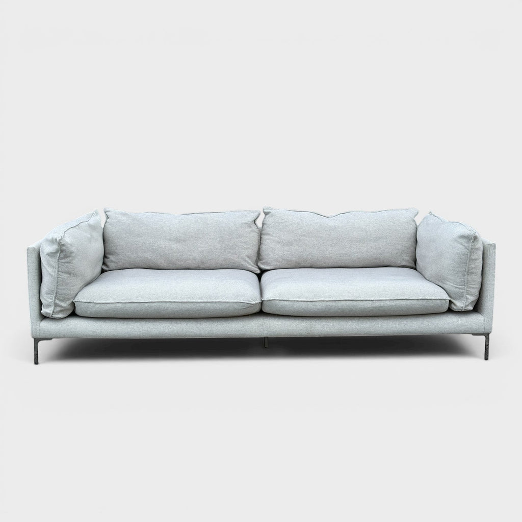 RehomedHere light grey three-seater sofa with plush cushions and slim stainless steel legs, modern design.