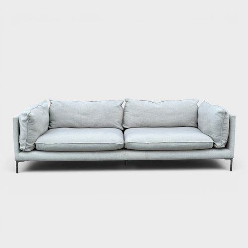 RehomedHere light grey three-seater sofa with plush cushions and slim stainless steel legs, modern design.